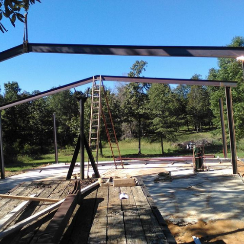 A building getting welding done to its roof