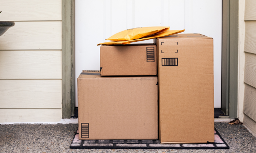 Delivered mail boxes at the foot of a door