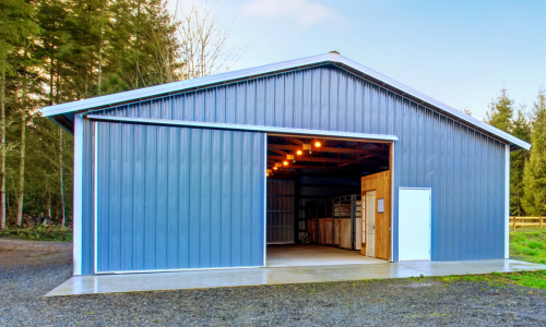 A blue pole barn set up outside