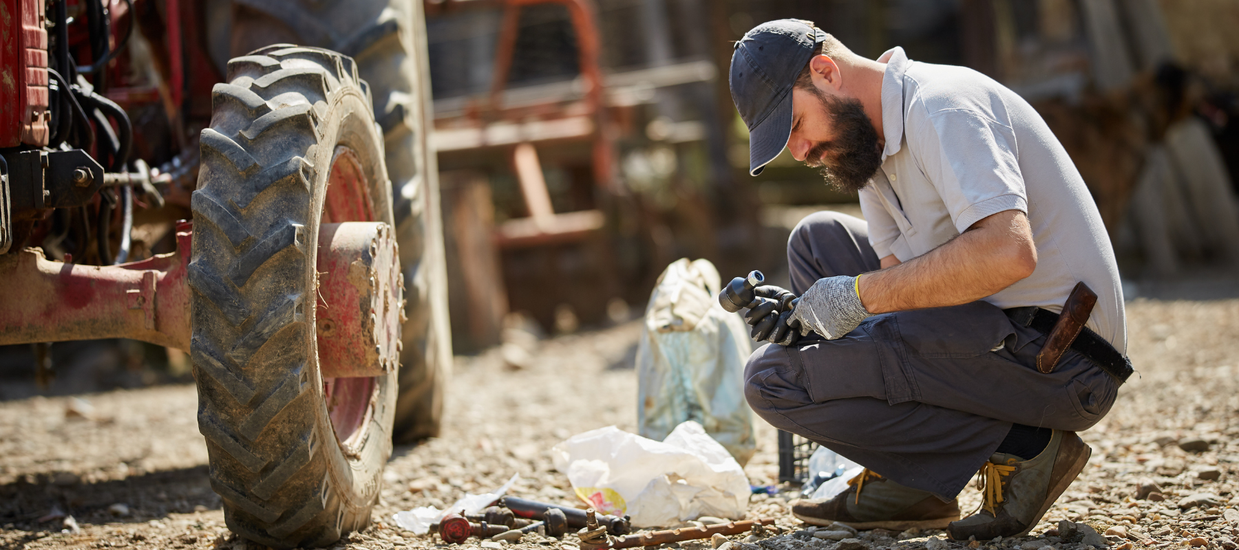 A farmer working on a tractor