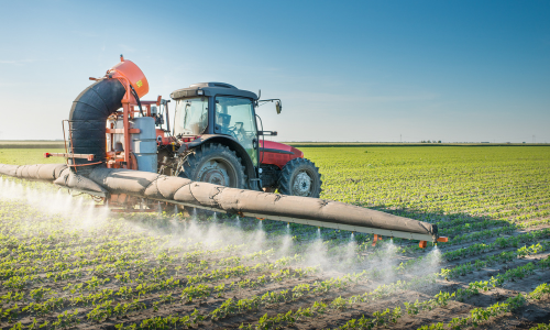A crop field being sprayed